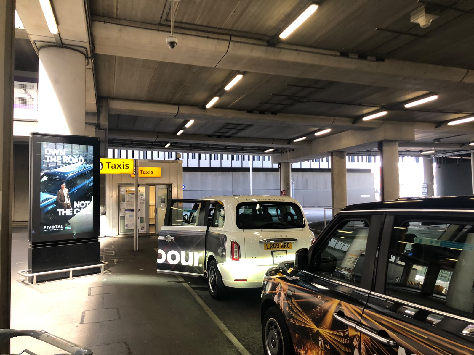 Black taxis and taxi rank at Heathrow Airport